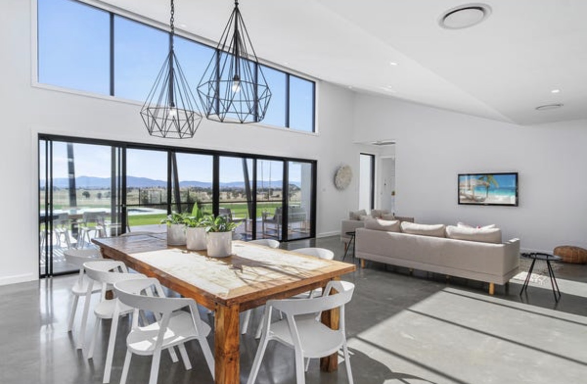 Interior of a luxury minimalist kitchen with marble countertops in a Hinterland Building home
