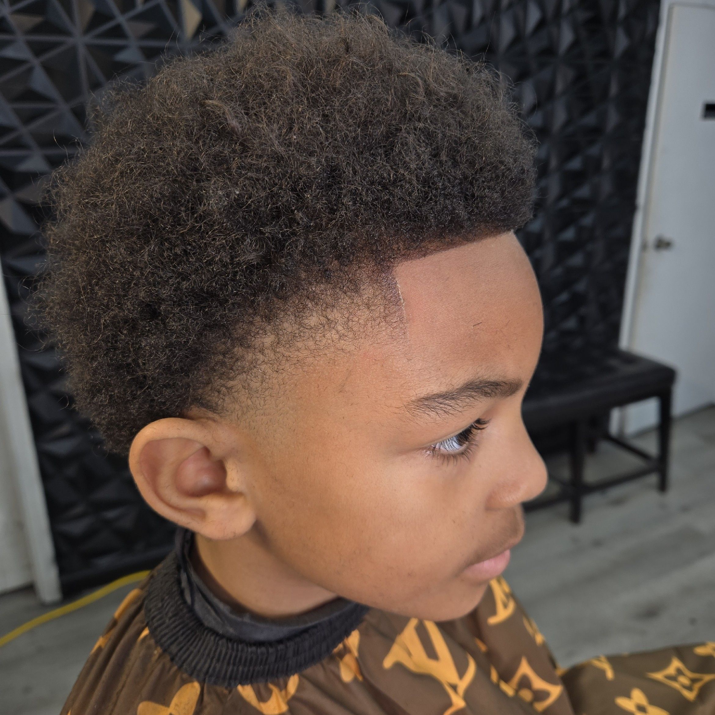Precision skin fade haircut at Addison barbershop