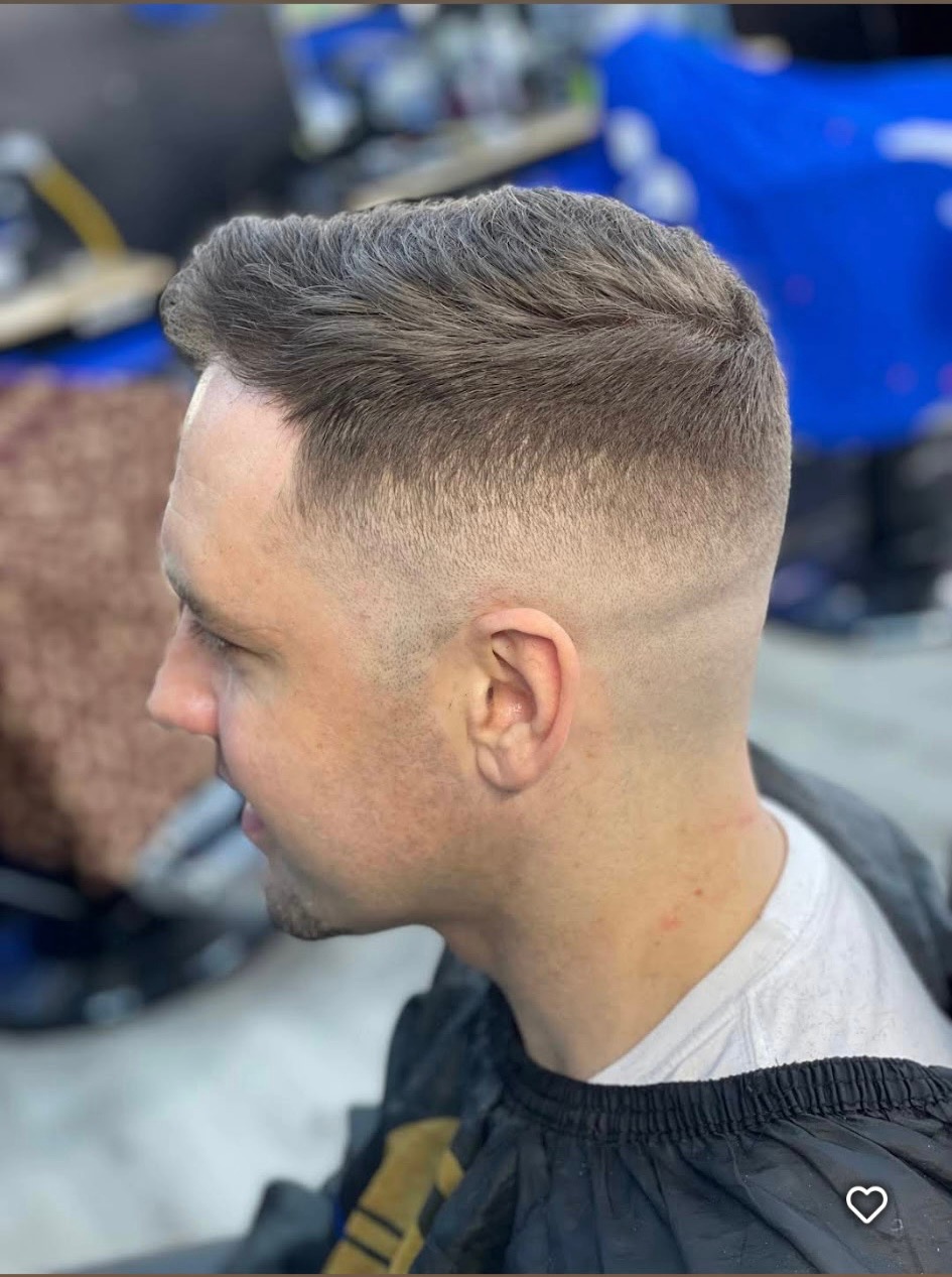 Founder of Precision Luxe Barbershop, a retired pro football player