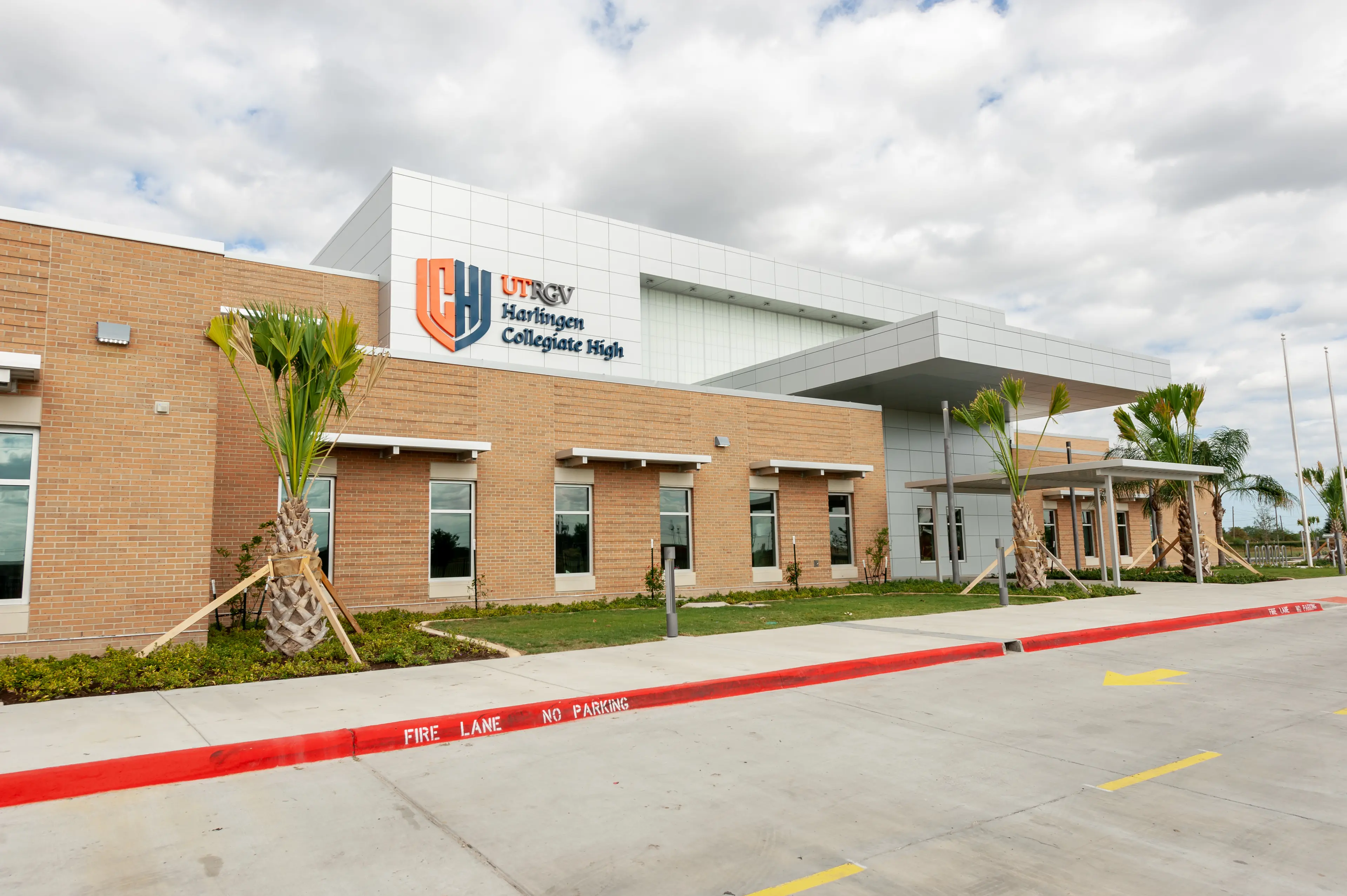 Modern campus of a large RGV public high school with students walking