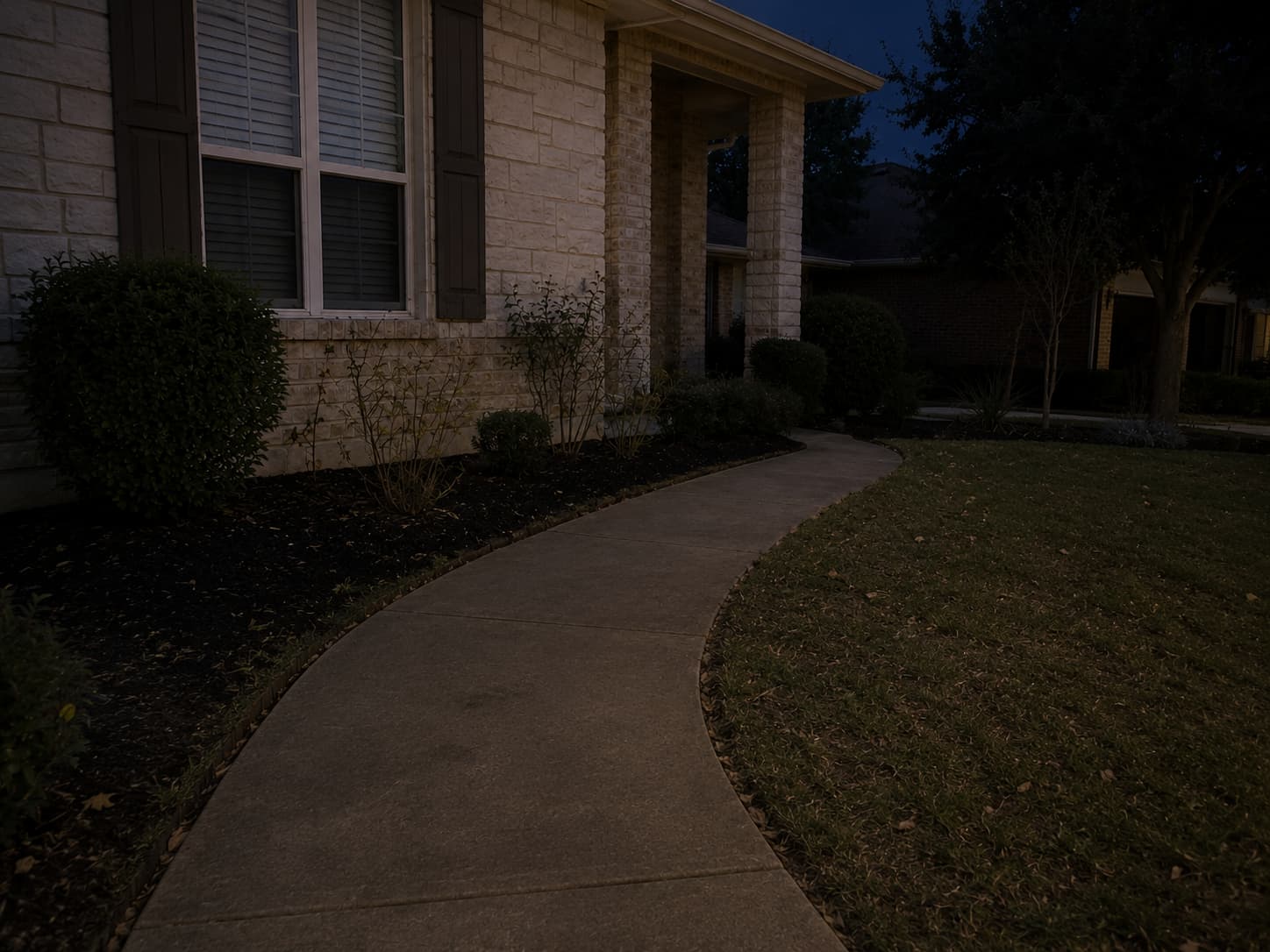 Walkway before outdoor lighting upgrade at dusk