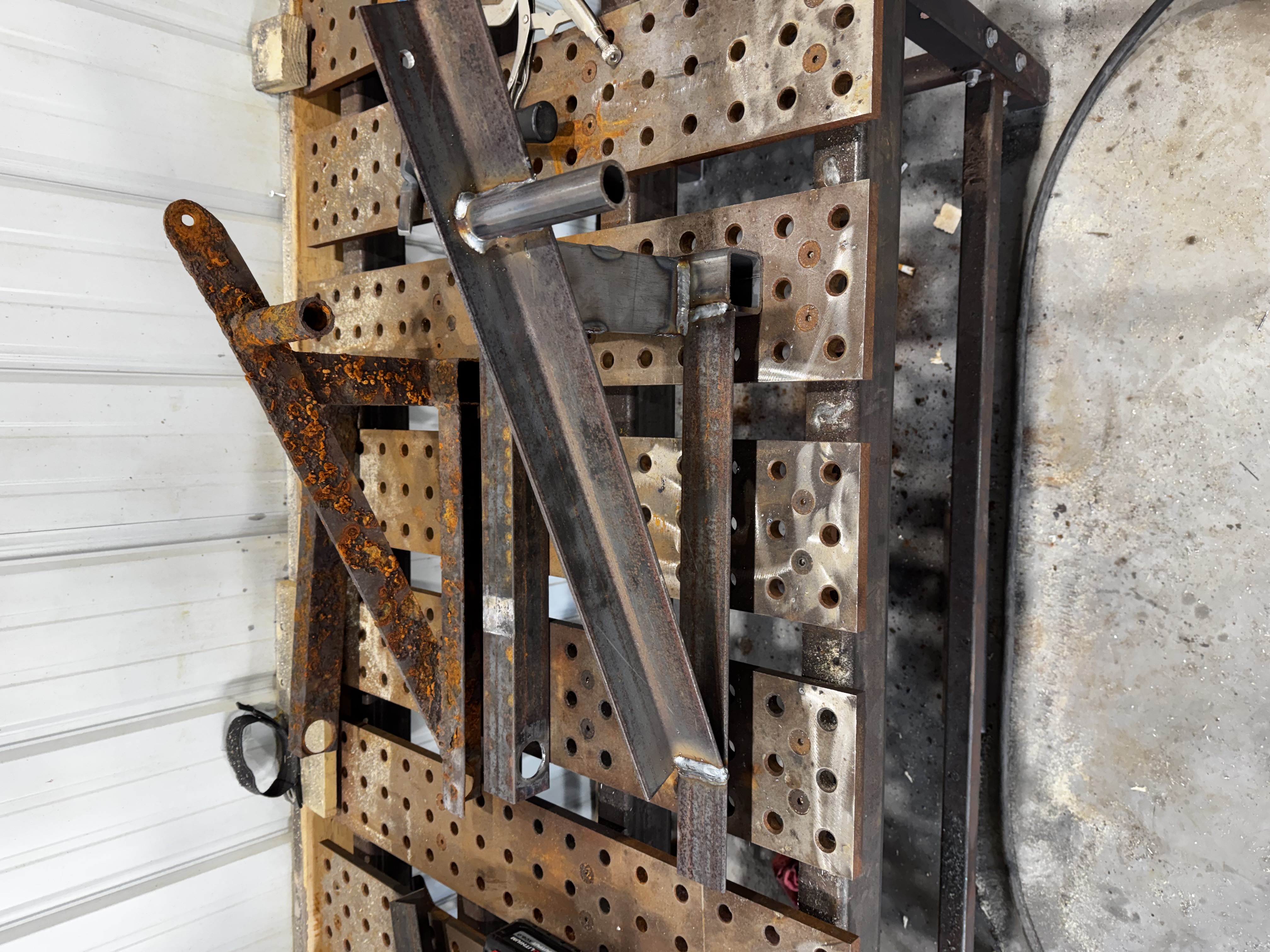 Close up of strong, fresh welds on a repaired commercial utility trailer frame