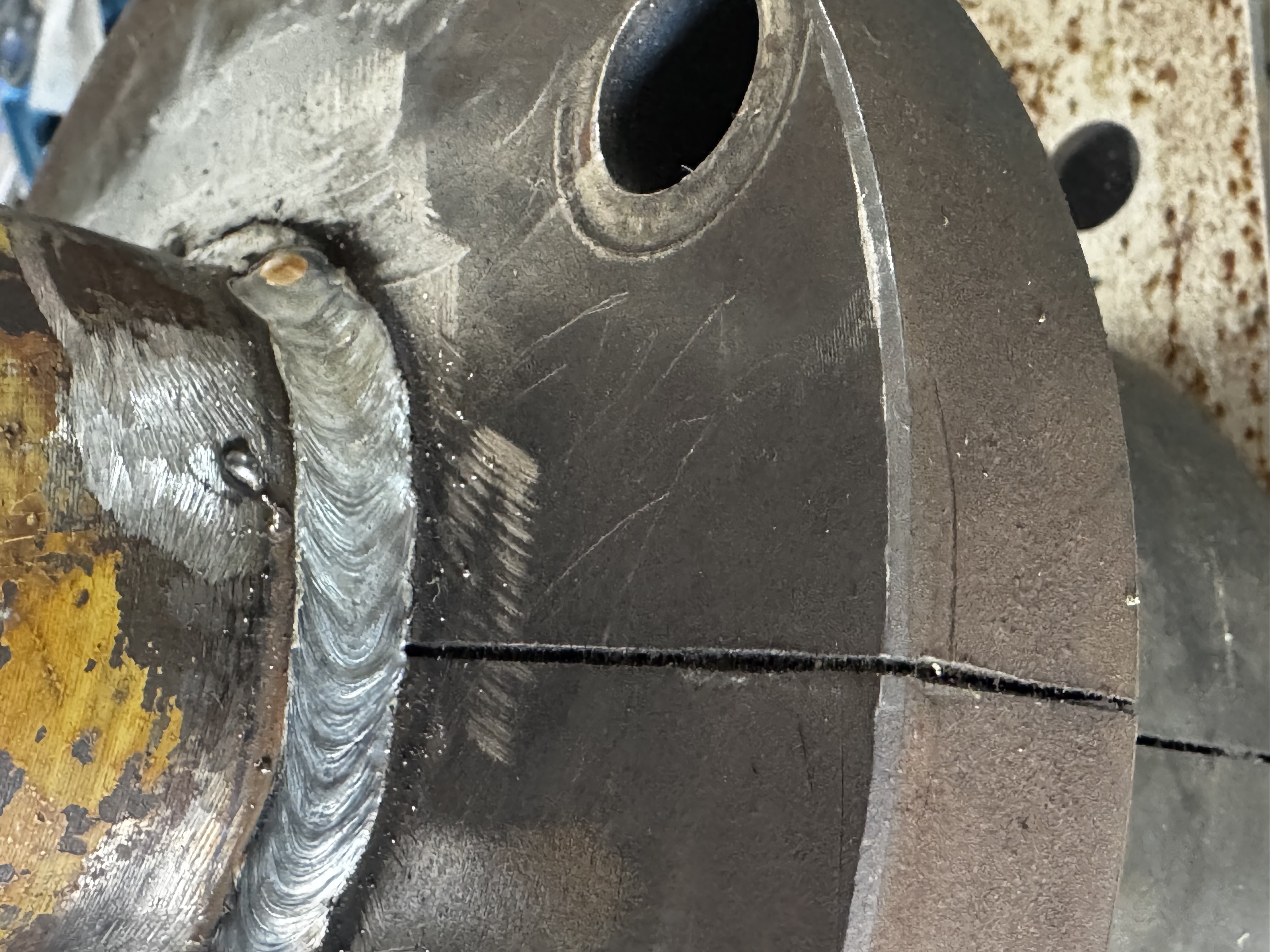 Mobile welding repair on a large agricultural farm tractor implement