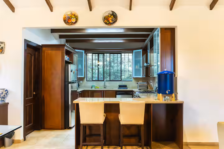 Modern rustic kitchen with stone countertops and wooden cabinets