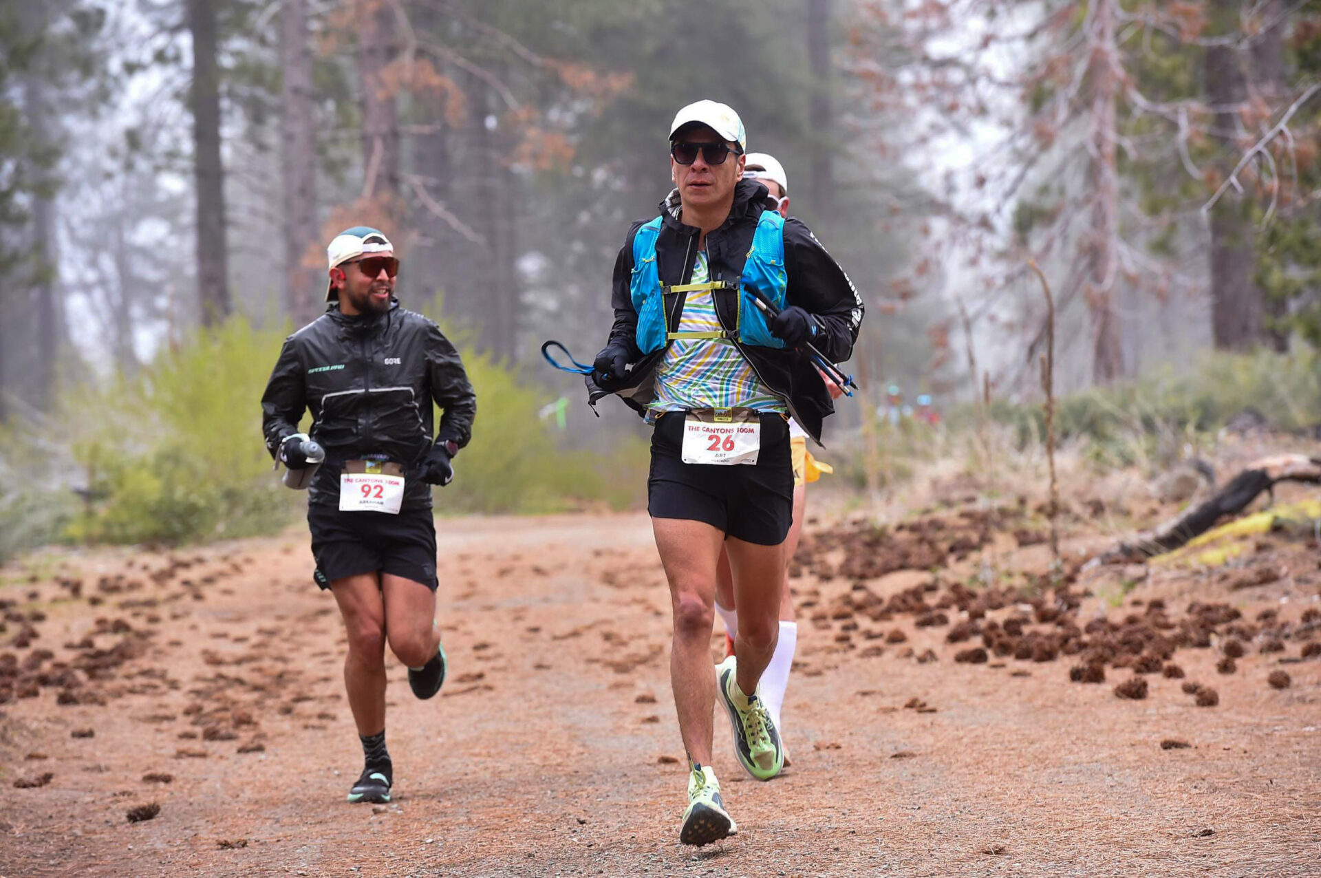 Trail runners navigating a path through a nature park in the Rio Grande Valley
