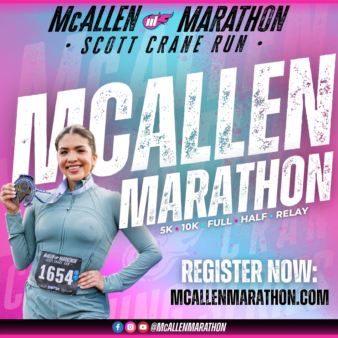 A large group of marathoners running through the streets of downtown McAllen, Texas