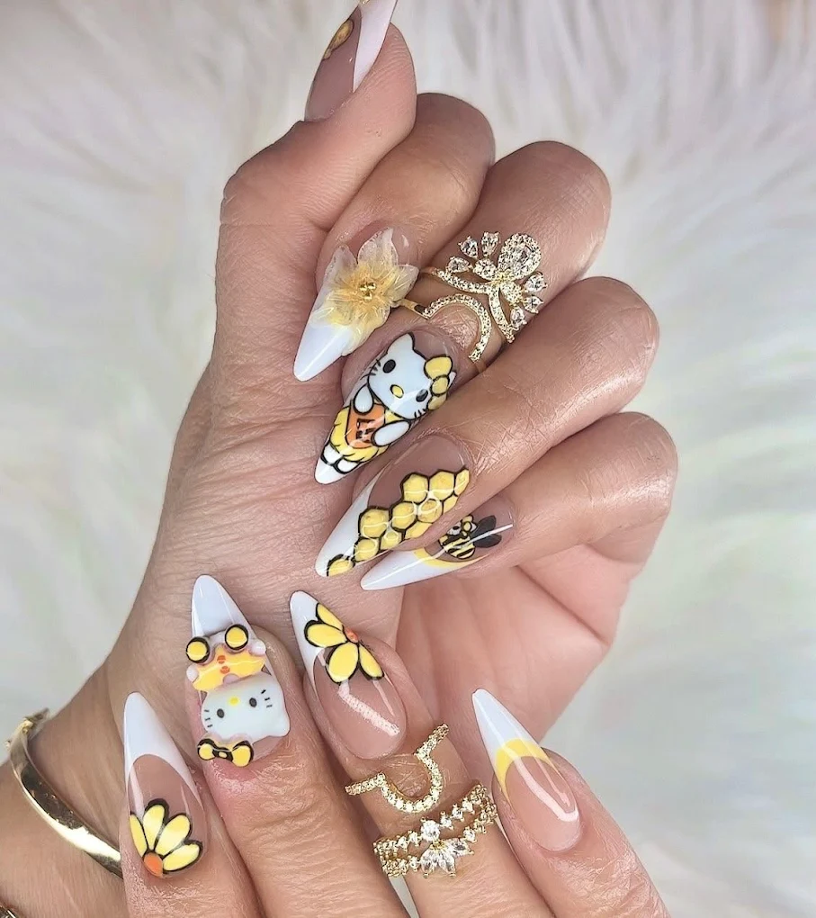 Close-up showcase of luxurious mirror chrome French manicure featuring high-shine reflective silver tips on long almond-shaped nails, photographed against soft pink silk fabric
