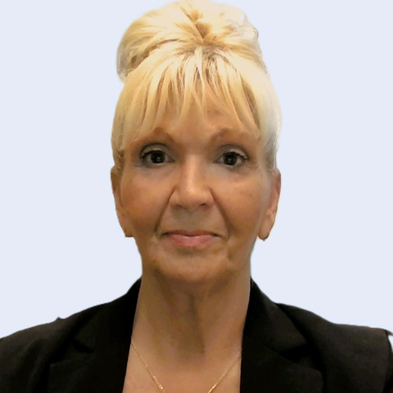 Professional headshot of experienced Chief Human Resources Officer in a modern corporate office