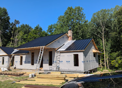 Custom home exterior screenshot showing modern residential build