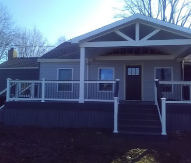 Custom deck build screenshot showing finished wooden outdoor deck with railings