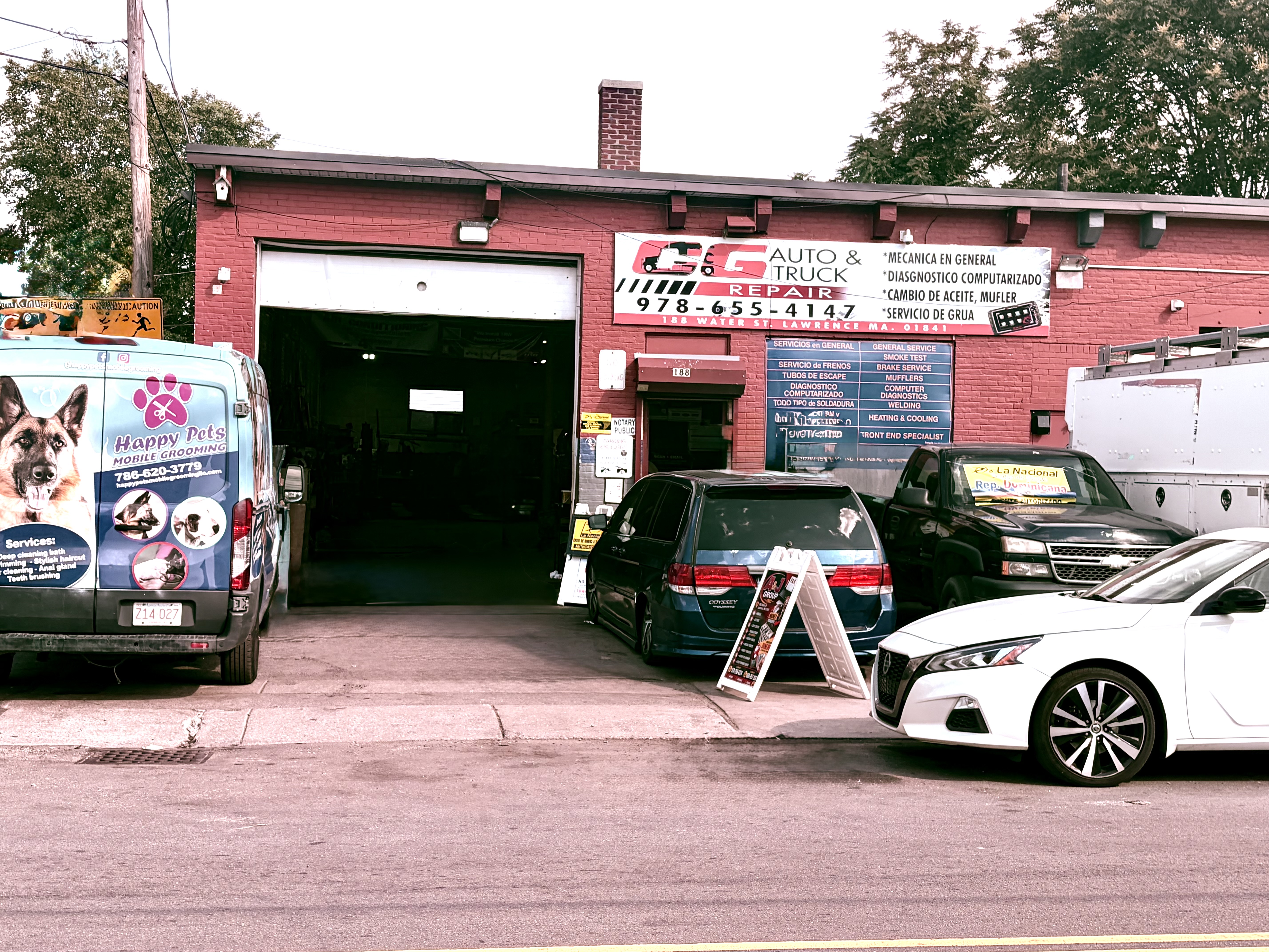 Professional mechanic performing diagnostics on a heavy-duty truck at CG Auto & Truck Repair