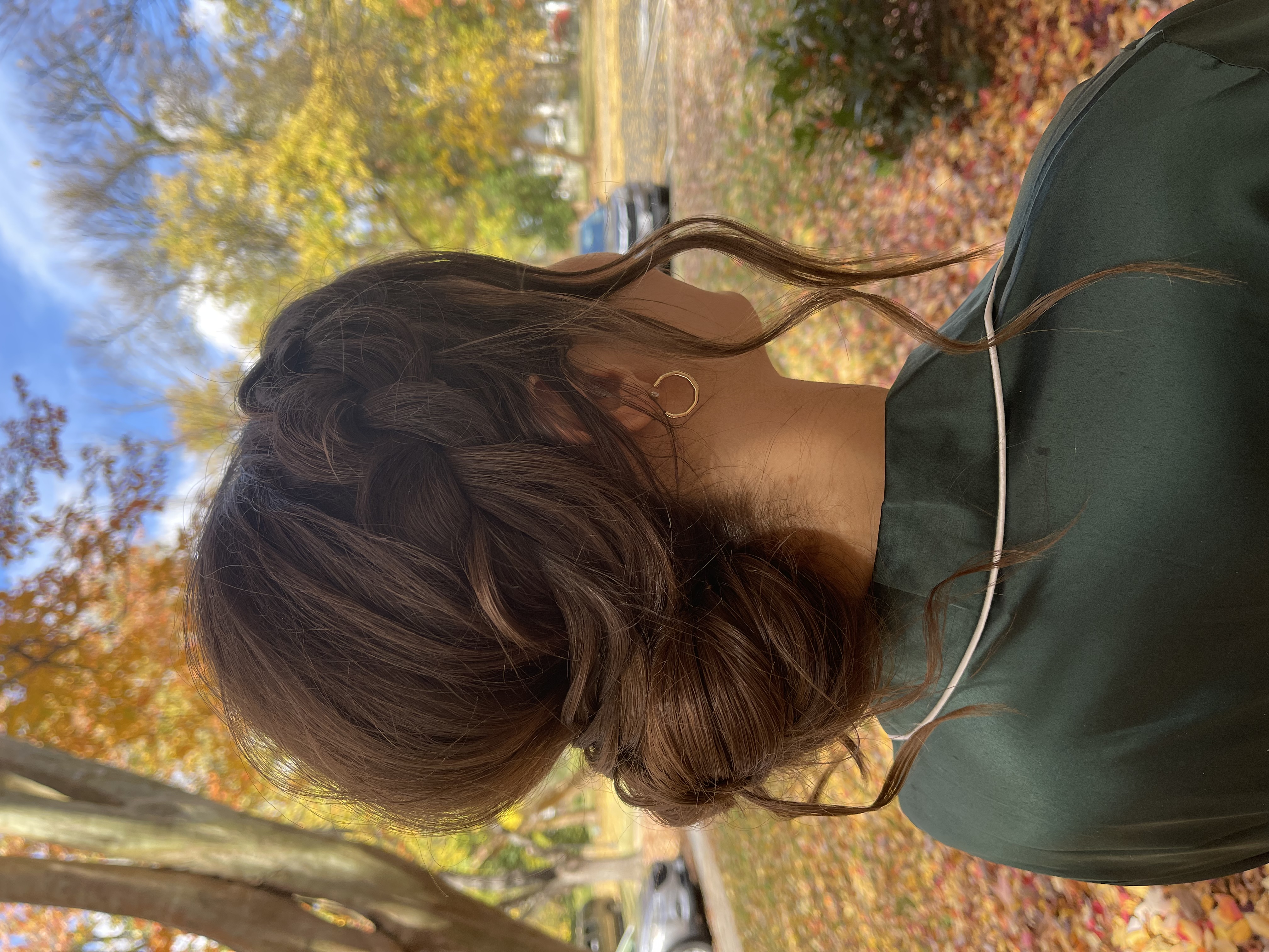 Sophisticated formal updo hairstyle with intricate braiding for wedding event
