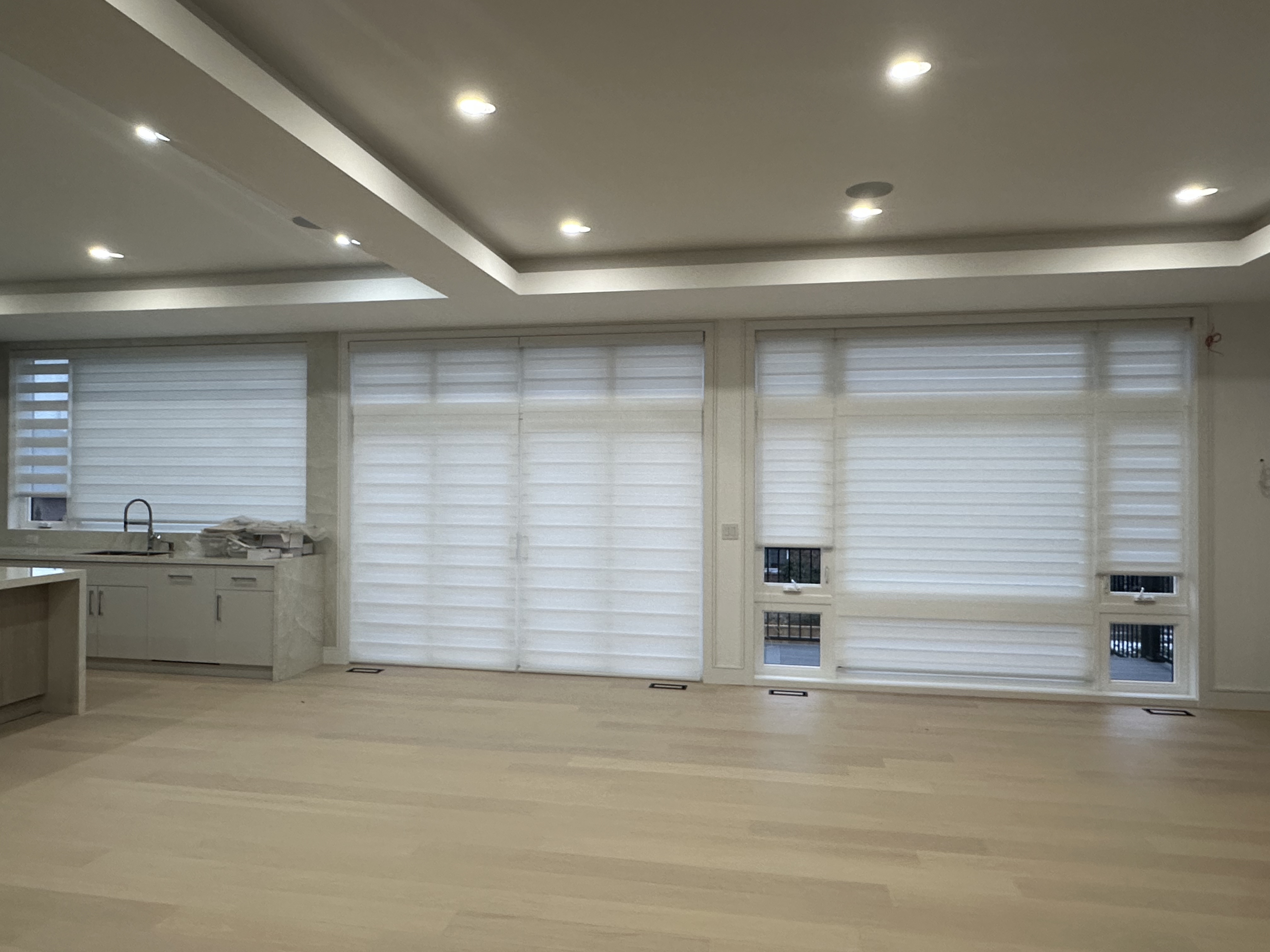High-end luxury living room in Vaughan featuring custom zebra blinds