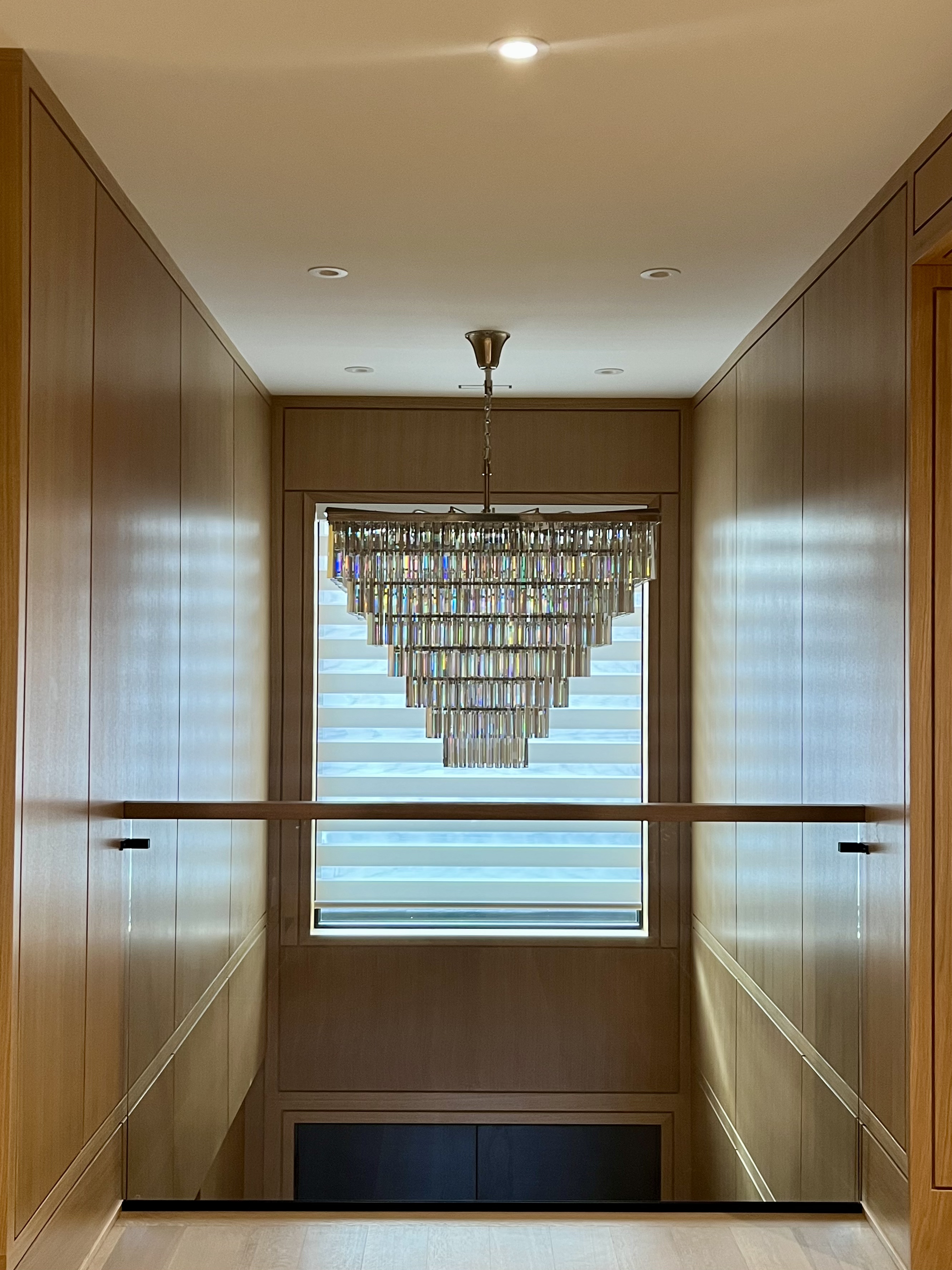 Light-filled luxury sunroom featuring floor to ceiling custom zebra blinds in an Oakville estate home