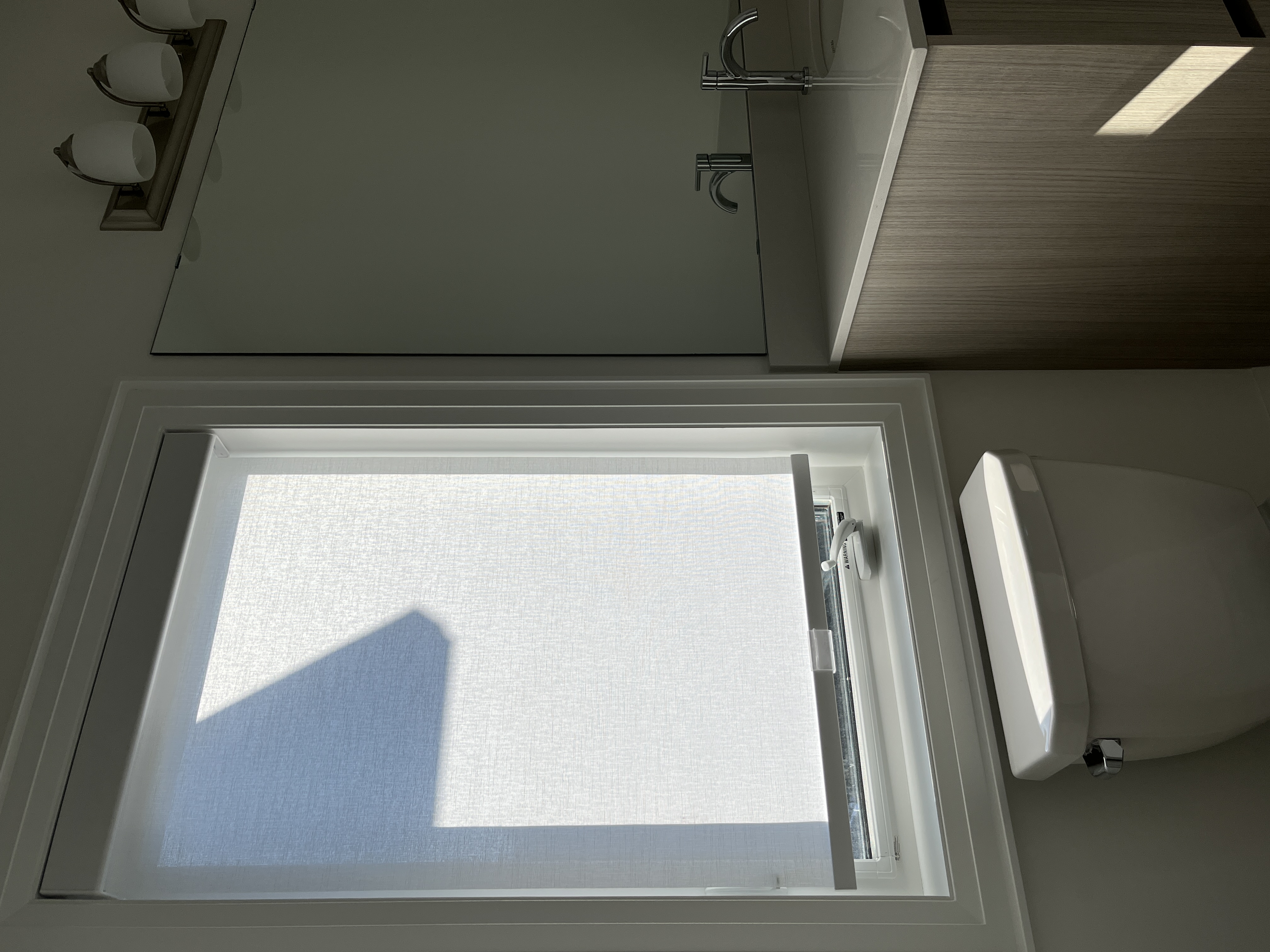 Serene spa inspired ensuite bathroom with elegant top down privacy shades in an Etobicoke luxury home