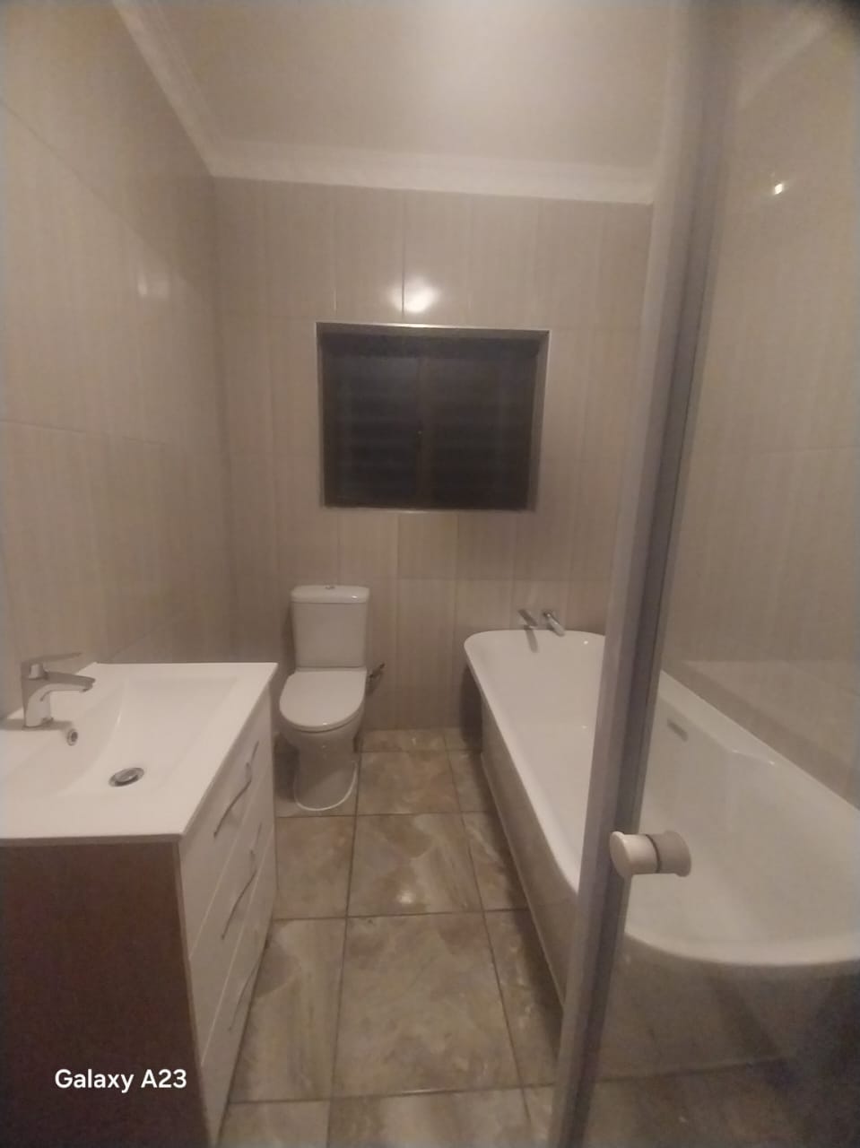 Luxury bathroom renovation featuring a spacious walk-in shower and stone finishes