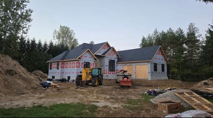 Freshly poured concrete driveway, patio, and foundation work by Reimer Works Contracting in Norfolk