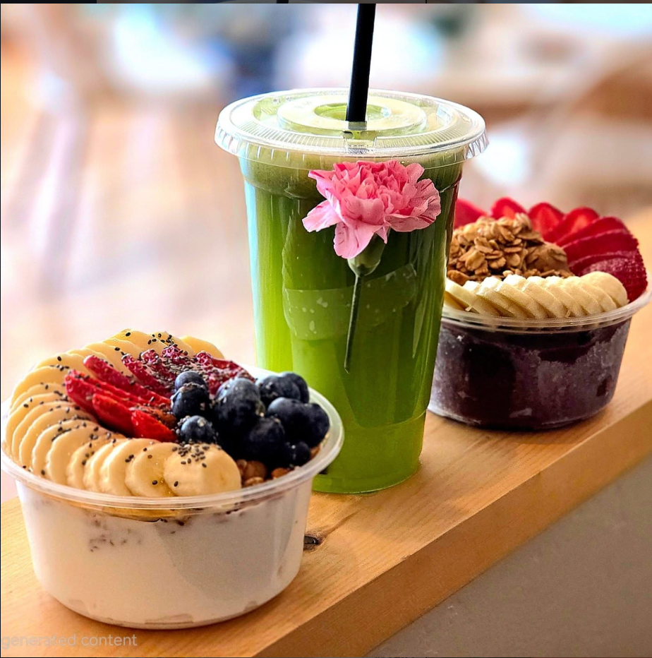 Freshly made colorful acai bowl topped with tropical fruits and granola