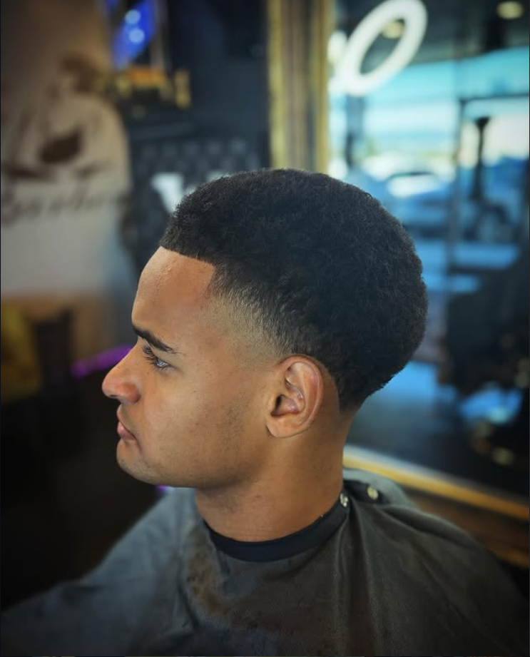Low taper fade haircut styled to perfection