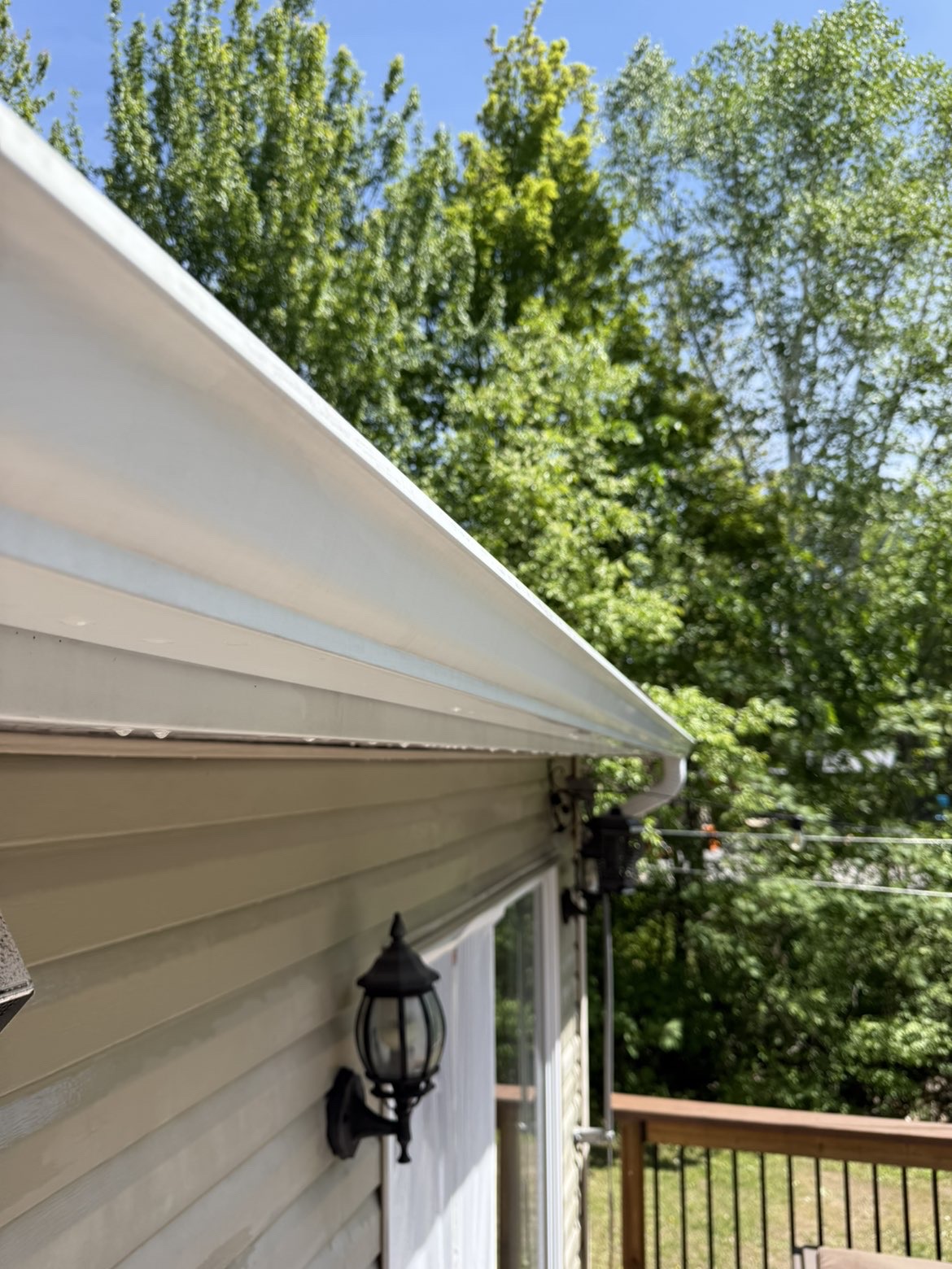 After - clean white gutters fully cleared and restored to like-new condition by Clean Slate Exteriors