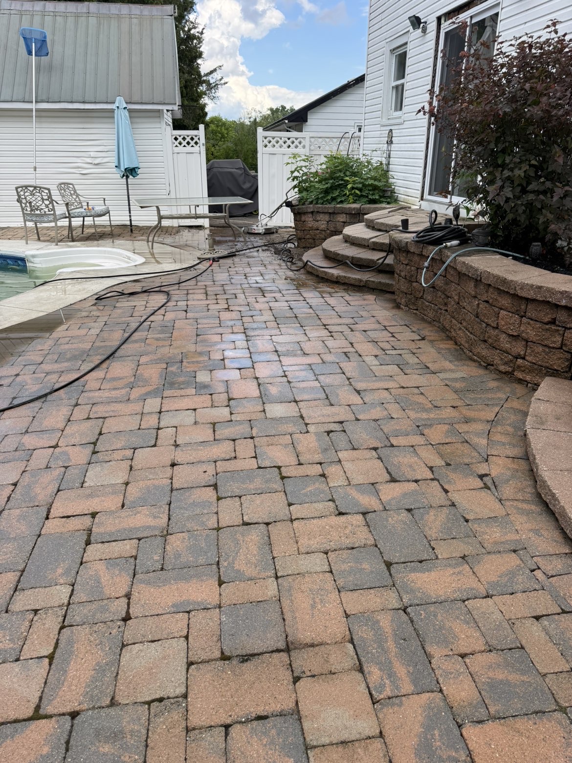 After - cleaned interlock pavers with moss removed and fresh joint sand re-applied by Clean Slate