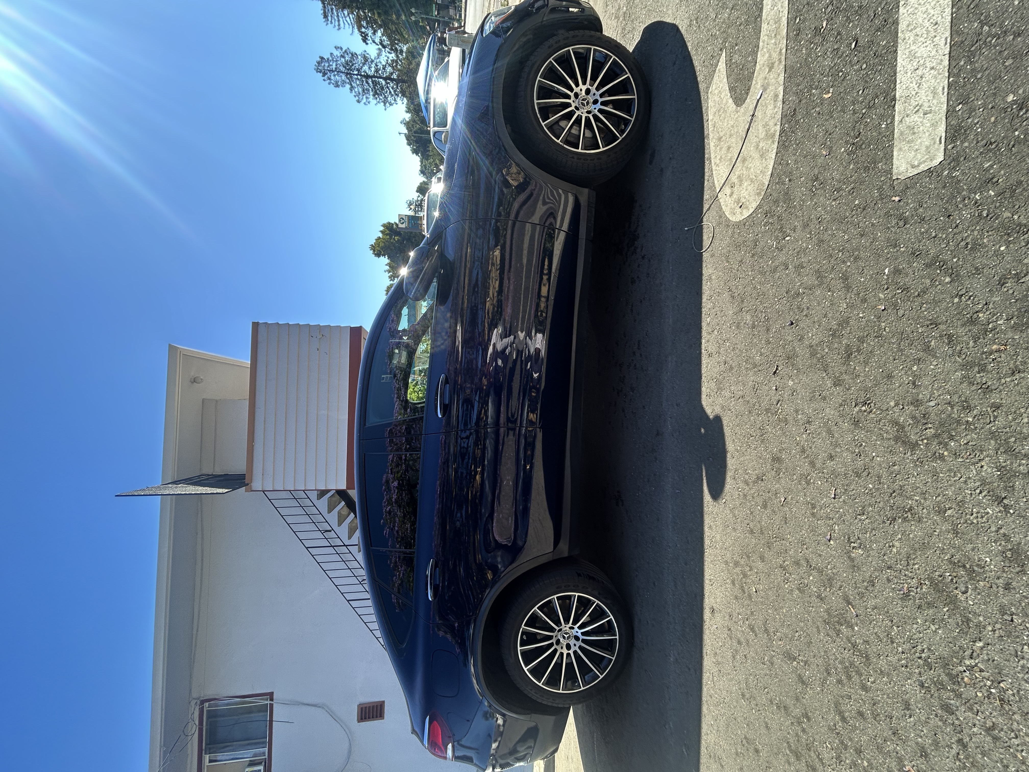 Thick snow foam applied to a sports car during mobile wash