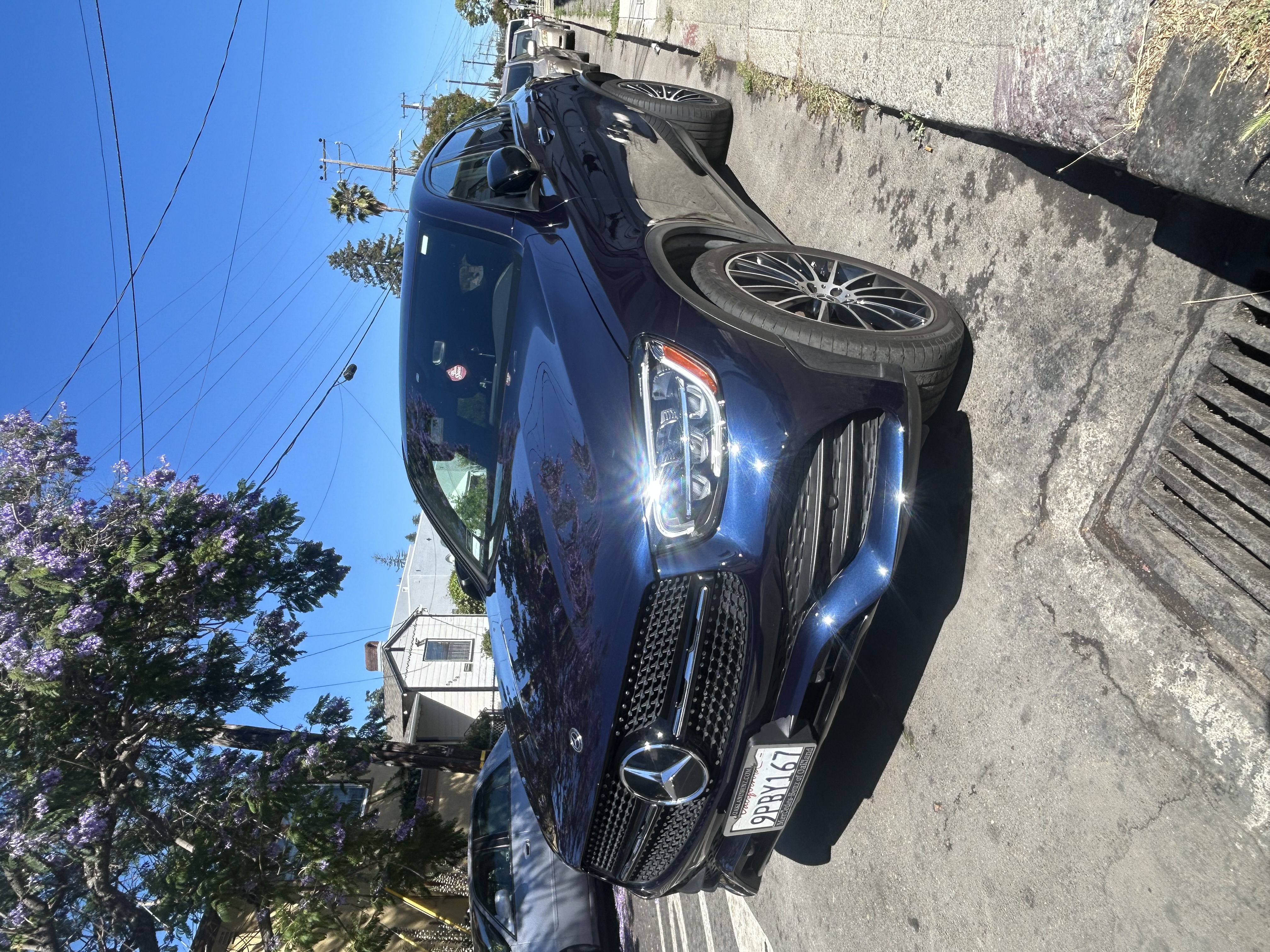 Close up of highly polished alloy wheels and dressed tires