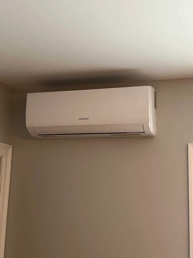 Sleek wall-mounted Samsung ductless mini-split HVAC system installed on a modern interior wall