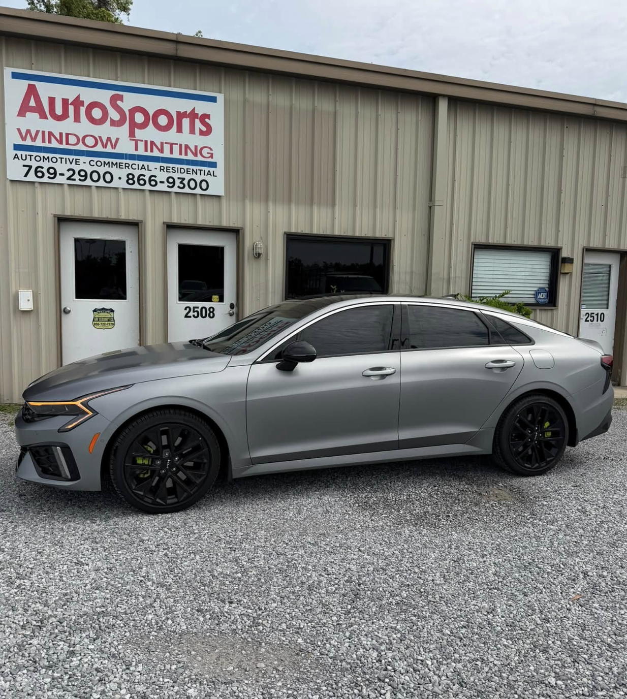 Dark grey coupe with ceramic window tint detailing showing flawless factory finish
