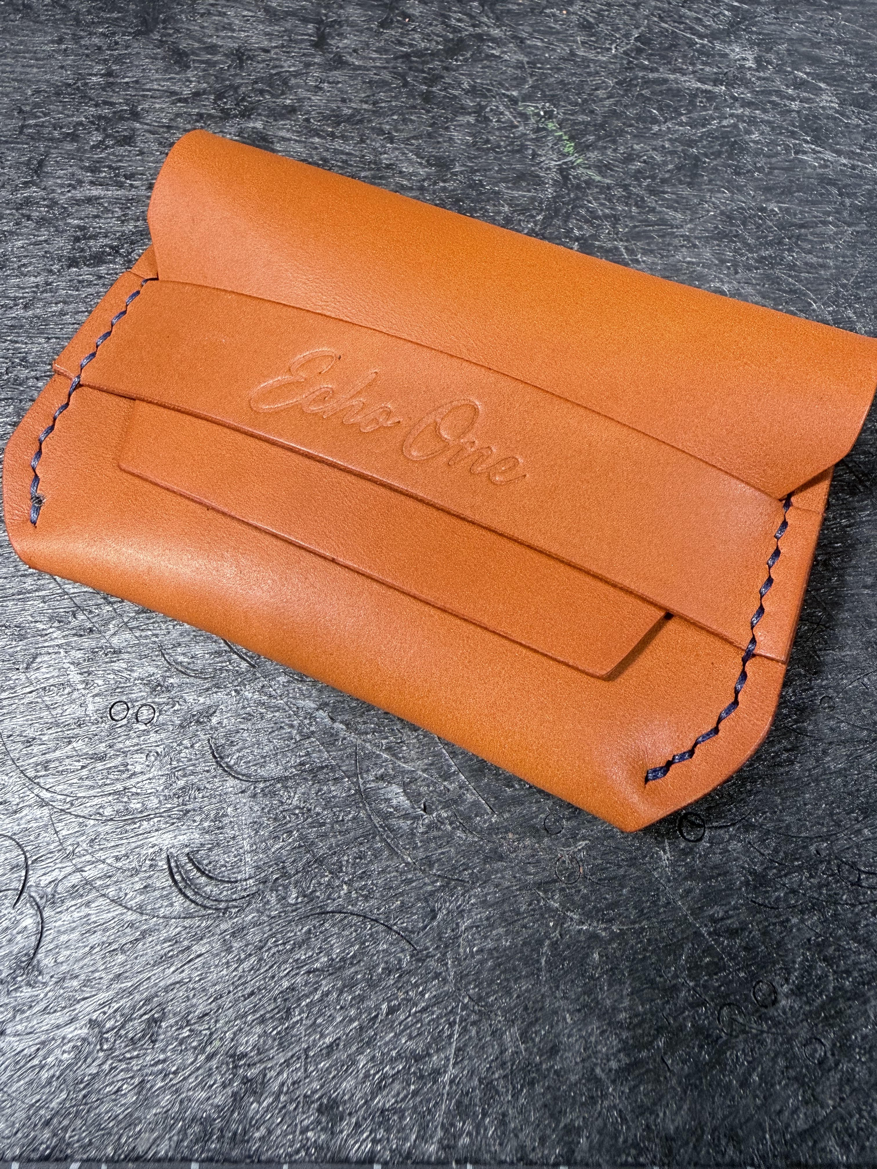 Hand-stitched leather wallet.
