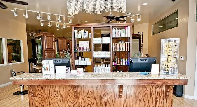 Elegant luxurious interior of Madison Avenue Salon and Day Spa featuring marble styling stations, soft golden lighting, fresh florals, and a serene welcoming atmosphere in Ridgecrest California