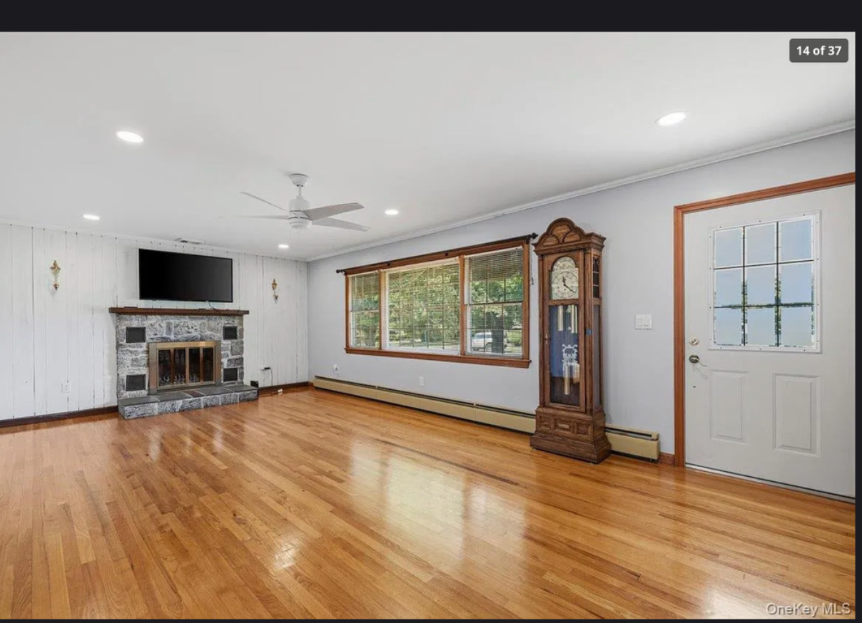 Interior living space at 870 Crittens Lane showcasing 1,588 sq ft of warm, comfortable living areas with classic mid-century character
