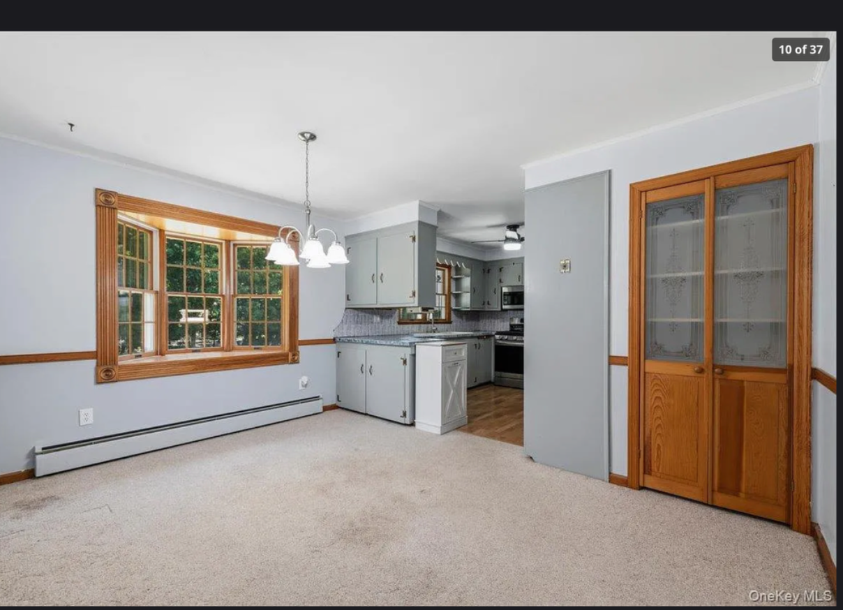 Charming dining area at 870 Crittens Lane in Southold — featuring vintage 1954 character, warm wood tones, and an inviting space to gather with family on Long Island's North Fork
