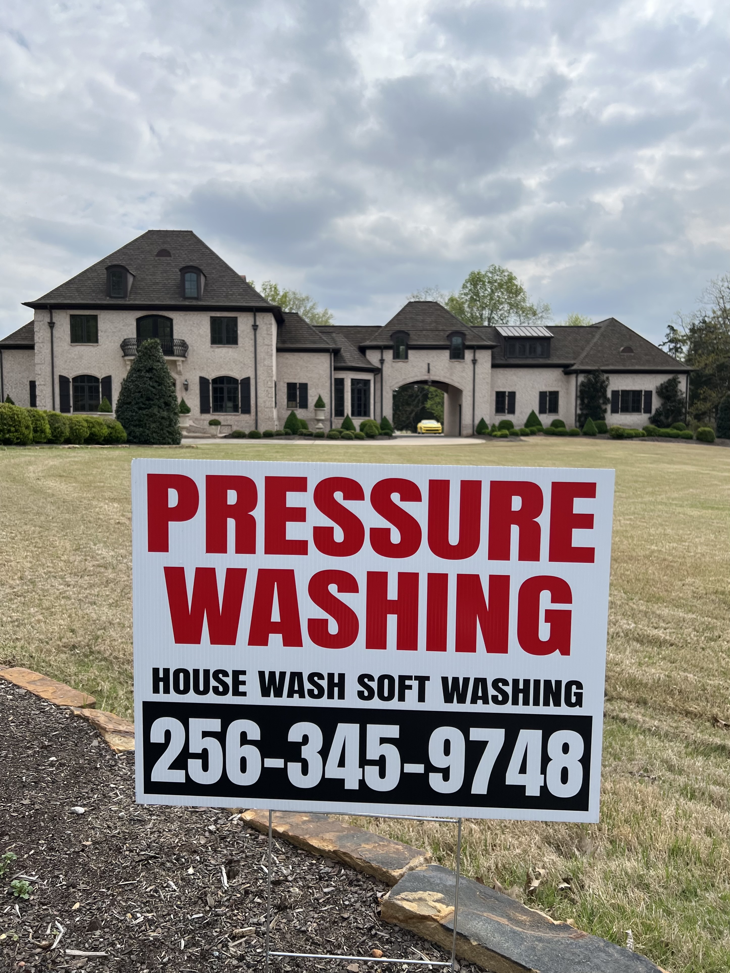High-resolution professional portrait of Winston, expert pressure washing technician from Sheltons Services, posing confidently with professional equipment