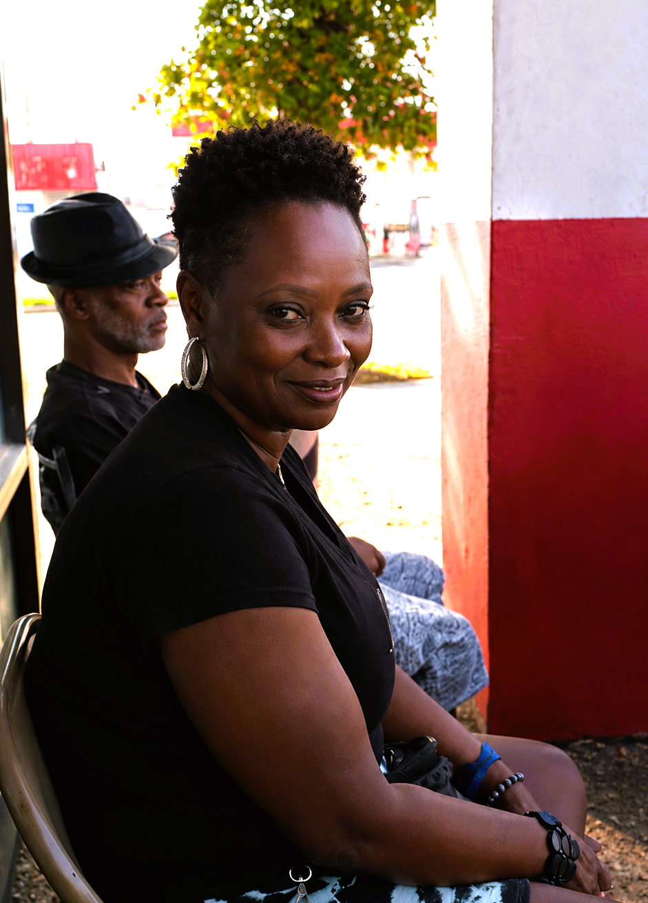 Satisfied client looking in the mirror after a fresh haircut at Chop Shop