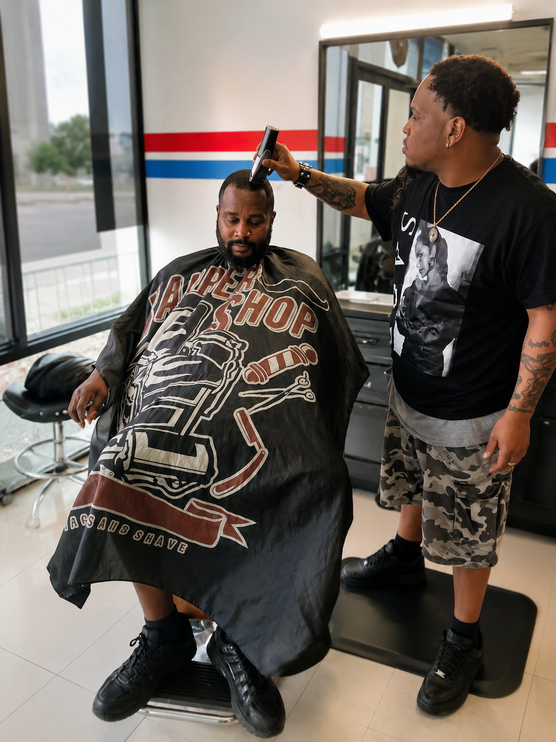 Chop Shop barbershop interior waiting lounge with leather chairs dark wood paneling and vintage masculine decor