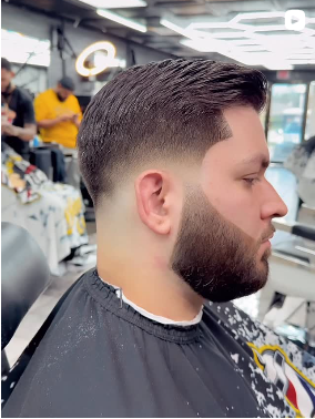 A detailed close-up shot of a perfect zero skin fade haircut on a client