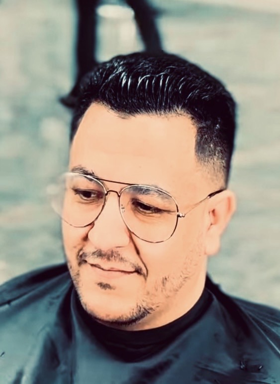 Detailed line-up work on a client's hair