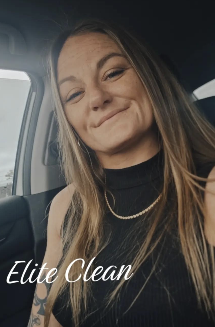 Kelsey Lynn, owner of Elite Cleaning, in a bright, modern coastal home