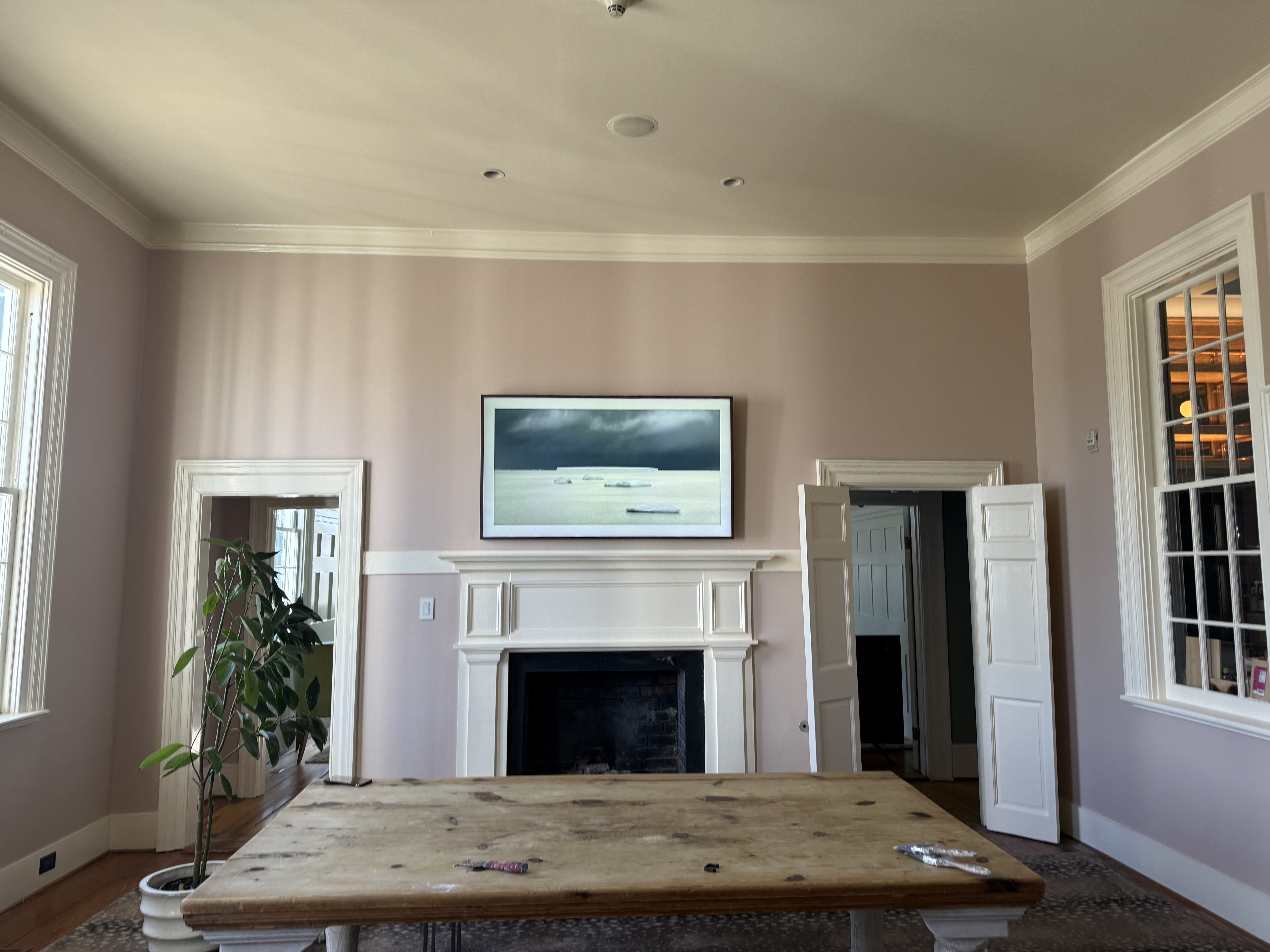 Pristinely painted modern living room with neutral tones and sharp lines