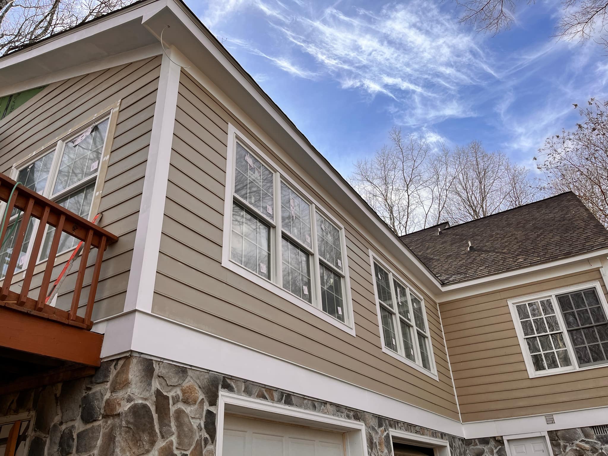 Exterior of a luxury two-story home with a fresh coat of white paint