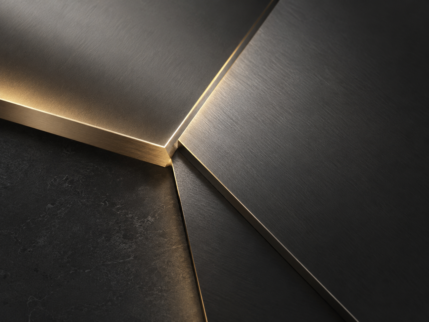 Macro detail of dark brushed metal with subtle gold accents