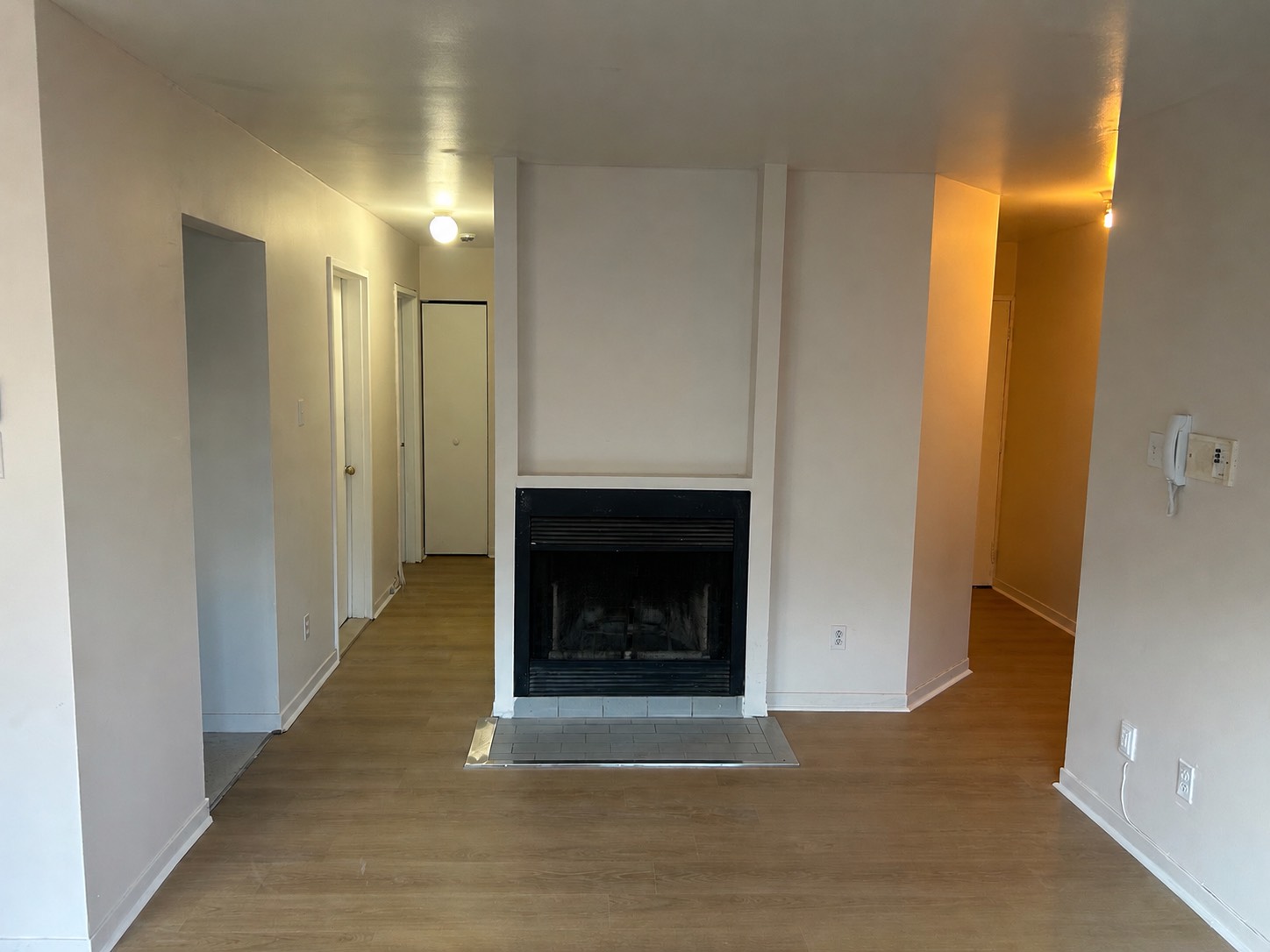 Professional craftsman installing solid hardwood parquet flooring with precision