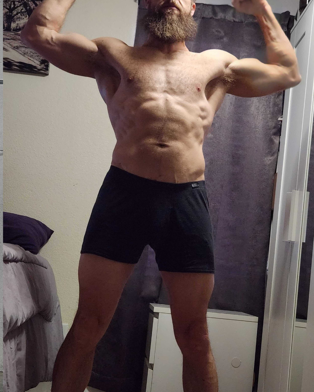 After transformation photo of male competitor Kyle at week sixty showing shredded six pack abs and lean muscular fizeek