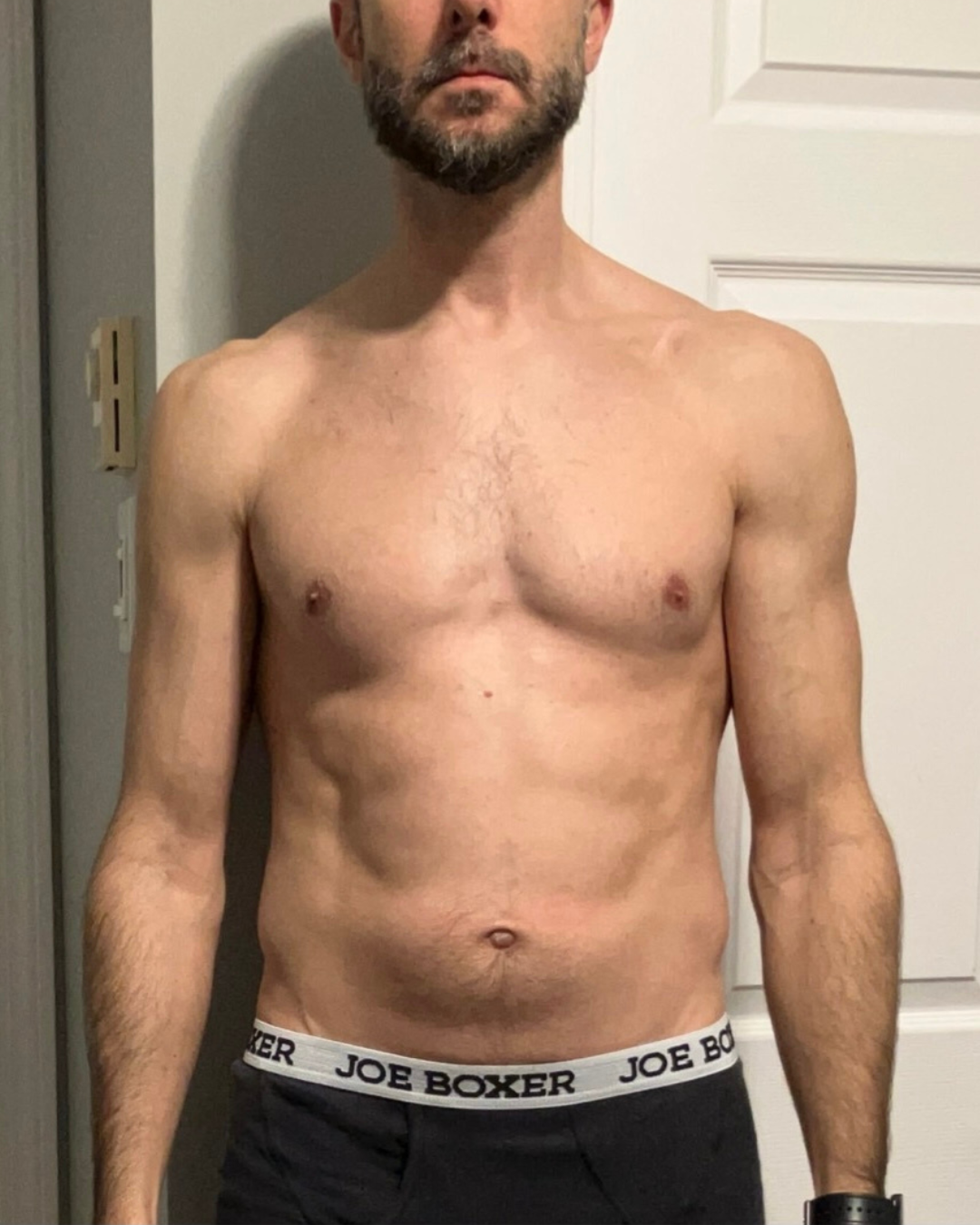 Before transformation photo of male competitor Anthony G on day one showing higher body fat percentage and untrained male physique
