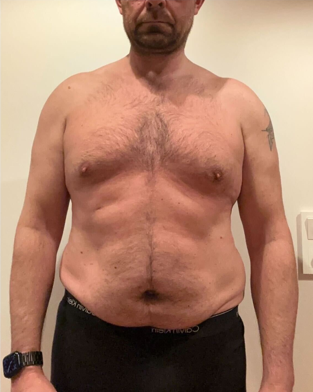 Before transformation photo of male three time competitor Jason K on day one showing softer midsection prior to FIZEEK FREEK challenge