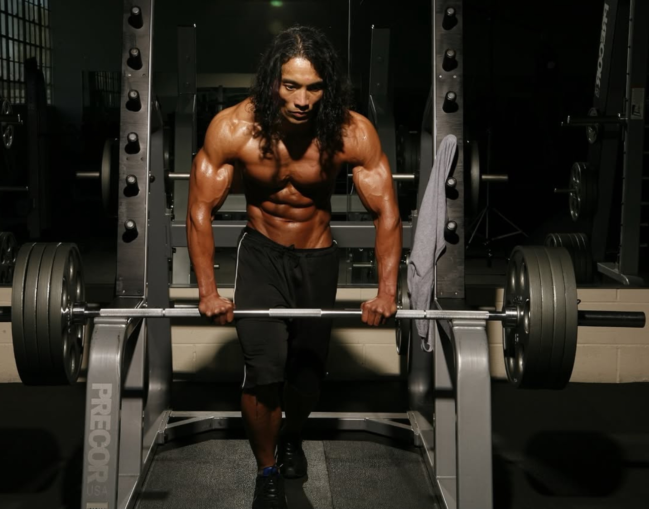 Professional headshot of male aesthetics specialist Javier Cruz with muscular build