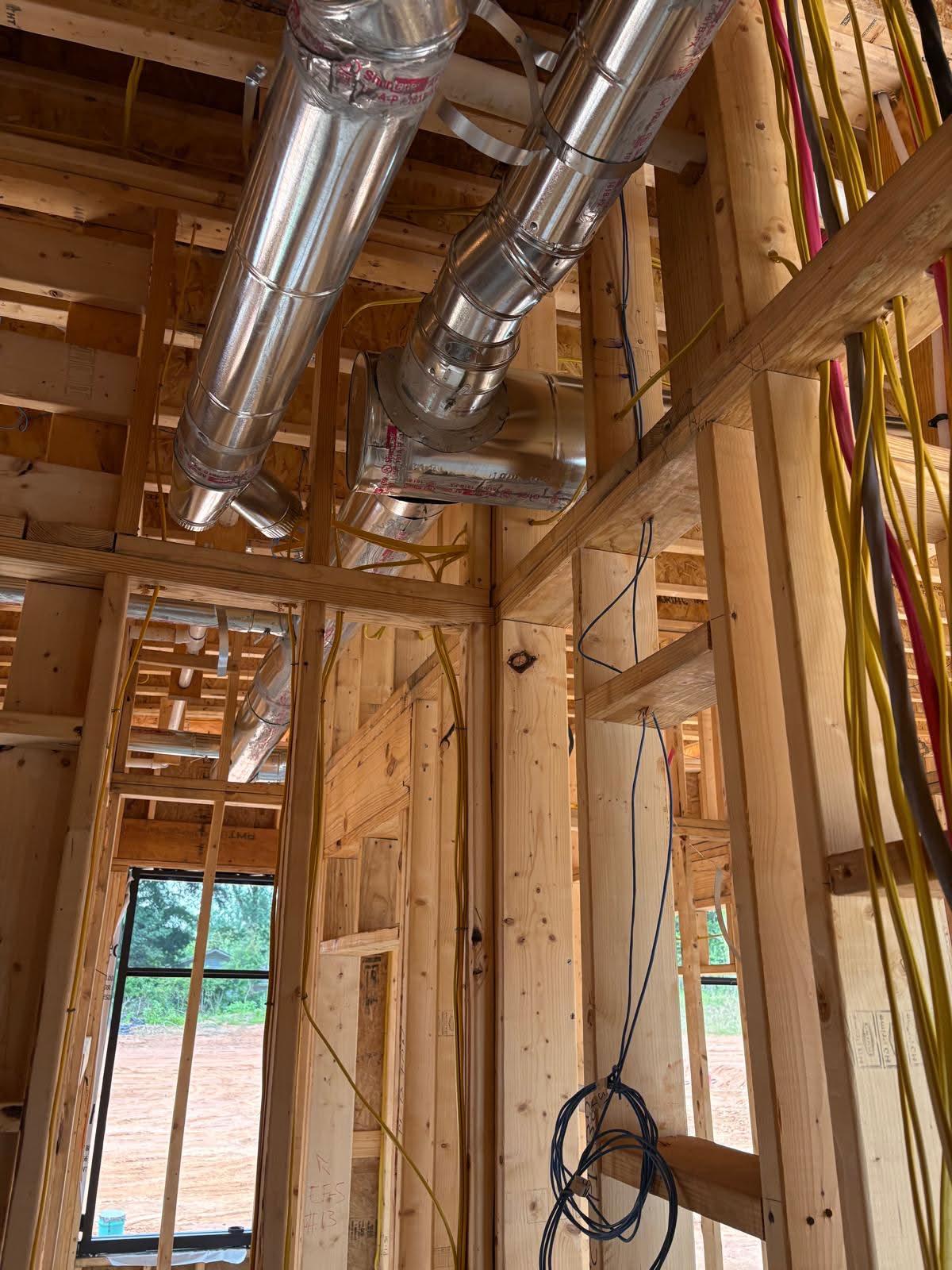 New construction commercial electrical rough-in with exposed wooden framing and organized wiring by GD&B3 One Source Mechanical Solutions