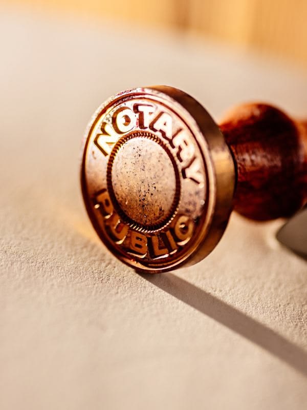 Professional agent stamping notary and DMV documents