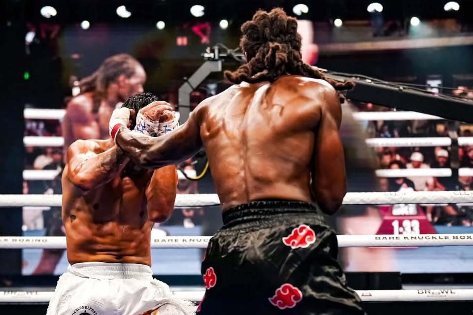 Two fighters engaged in intense Muay Thai sparring